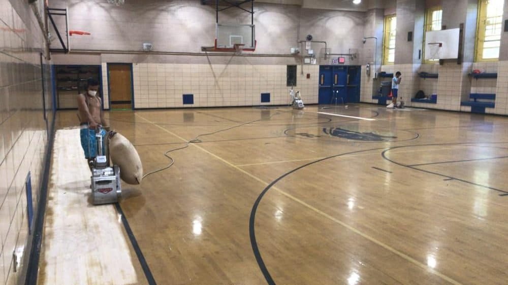 Sanding gym floors for schools in NYC